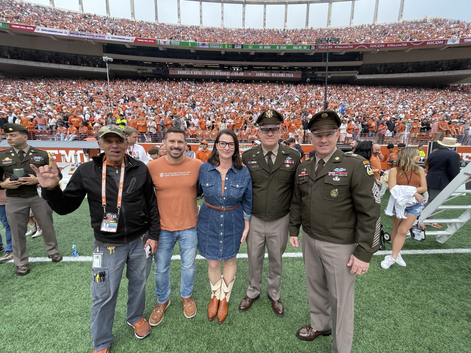 Group photo at the 11/23 Longhorns game - Dr. Borah and General James Rainey